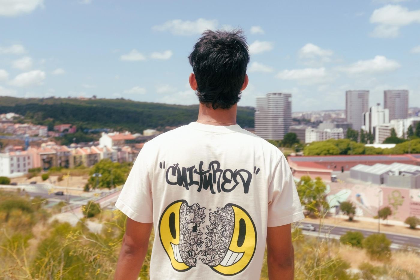 Cultured Apparel lookbook — Dubai rooftop, oversized hoodie at sunset